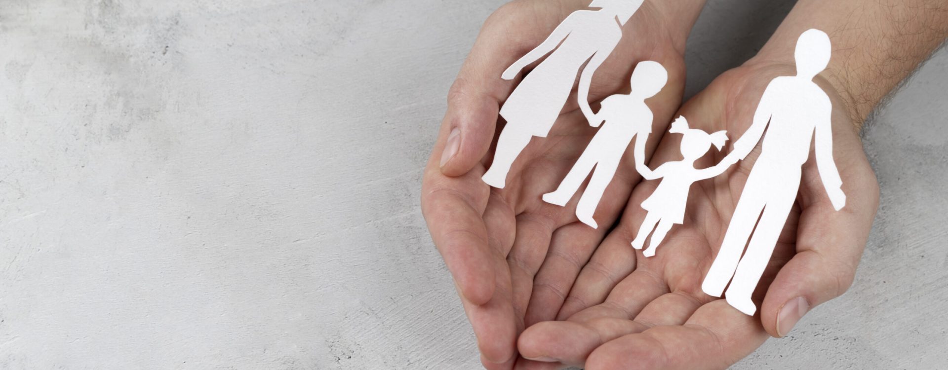 close-up-hands-holding-paper-family close-up-hands-holding-paper-family